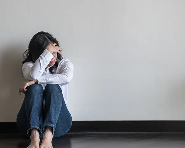 stressed woman in corner